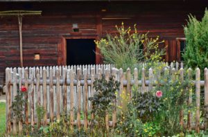 A beautiful red house with fence