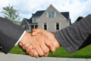 An image of two people shaking hands depicting as a partnership